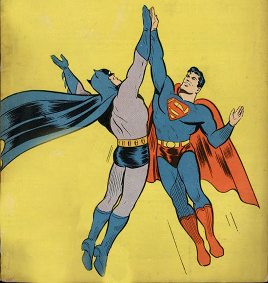 Superman high-fiving Batman